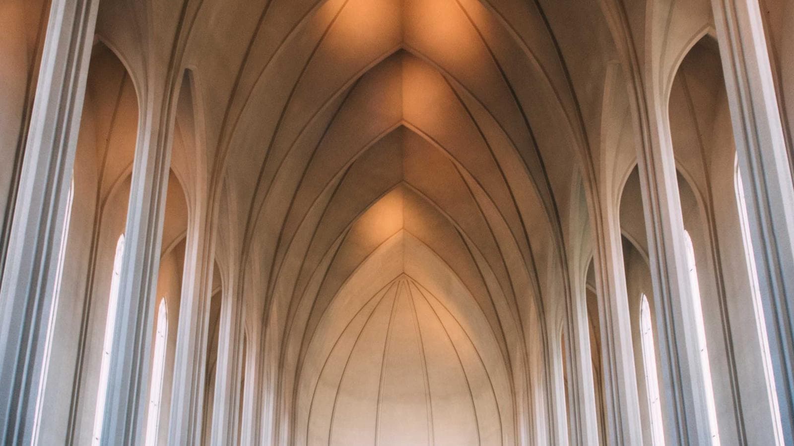 Fog drifting through layered mountain ridges
